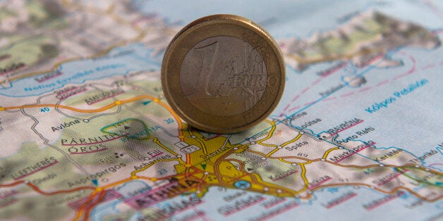 Euro coins on a map of Greece (Greek financial crisis)