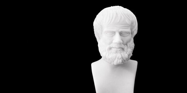 Greek philosopher Aristotle (384-322 B.C.E.) sculpture isolated on black background