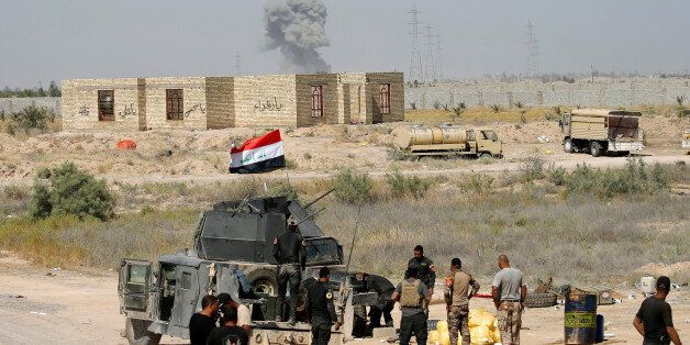 Iraqi security forces gather near Falluja, Iraq, May 31, 2016. REUTERS/Thaier Al-Sudani