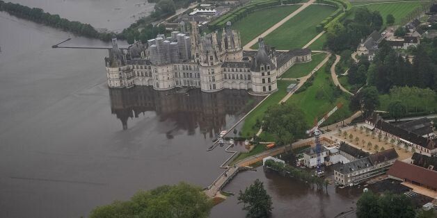 An aerial picture taken on June 2, 2016 shows the castle of Chambord, some 170 kilometers southwest of Paris, and its partly flooded park after the river Cosson went bursting it banks following heavy rainfalls.Some towns in central France are suffering their worst floods in more than a century, with more than 5,000 people evacuated since the weekend. Forecaster Meteo France described the situation as 'exceptional, worse than the floods of 1910', when even central Paris was flooded. / AFP / GUILLAUME SOUVANT (Photo credit should read GUILLAUME SOUVANT/AFP/Getty Images)