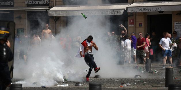 MARSEILLE, FRANCE - JUNE 11: England fans react after police sprayed tear gas during clashes ahead of the game against Russia later today on June 11, 2016 in Marseille, France. Football fans from around Europe have descended on France for the UEFA Euro 2016 football tournament. (Photo by Carl Court/Getty Images)
