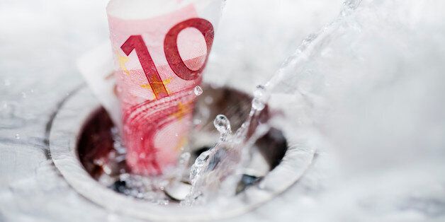 Ten euro bank note and splashing wÃ¡ter down the drain