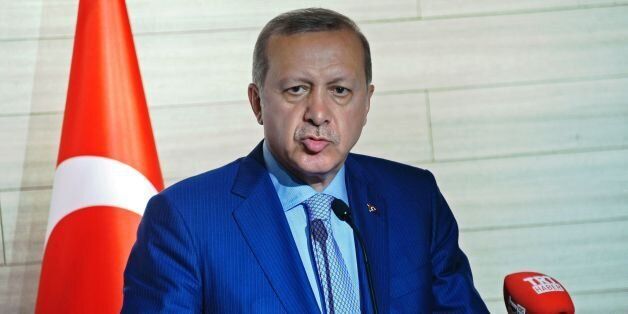 Turkey's President Recep Tayyip Erdogan speaks during a joint press conference with Somalia's President following the opening a new Turkish embassy in Mogadishu on June 3, 2016. Turkey's President Recep Tayyip Erdogan has visited Somalia on the third and last leg of his East African tour to open Turkish sponsored projects including health facilities and the largest Turkish embassy in the world. Erdogan is the only non-African president to visit Somalia in decades. Turkey is also set to open its first military base in Africa where Turkish military officers will train Somali troops and soldiers from other African countries. / AFP / MOHAMED ABDIWAHAB (Photo credit should read MOHAMED ABDIWAHAB/AFP/Getty Images)