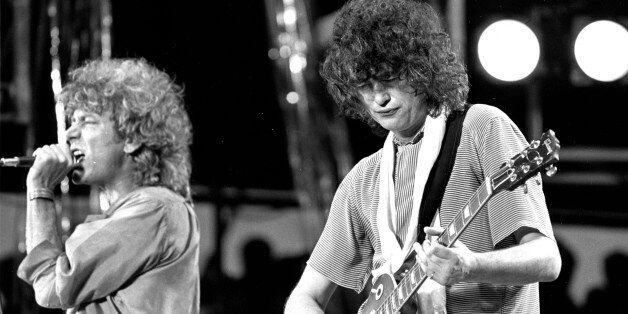 ** FILE ** Singer Robert Plant, left, and guitarist Jimmy Page, right, of the British rock band Led Zeppelin perform at the Live Aid concert at Philadelphia's J.F.K. Stadium in this file photo July 13, 1985. Led Zeppelin, one of the last major acts to resist digital distribution, are releasing their back catalog online. Songs including