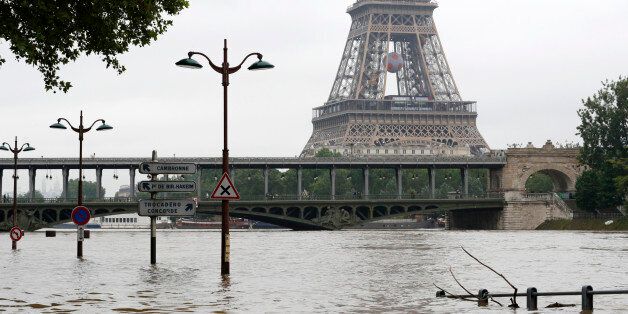 View of the flooded river-side of the River Seine near the Eiffel tower in Paris, France, after days of almost non-stop rain caused flooding in the country, June 3, 2016. REUTERS/Philippe Wojazer