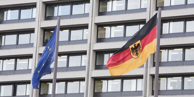 The European Union (EU) flag, left, flies beside Germany's national flag outside the Deutsche Bundesbank in Frankfurt, Germany, on Thursday, Feb. 24, 2016. German business confidence fell for a third month in a sign that companies in Europe's largest economy are growing more concerned as slowing global growth roils financial markets. Photographer: Martin Leissl/Bloomberg via Getty Images