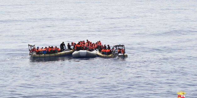 This undated image made available Monday, May 30, 2016 by the Italian Navy Marina Militare shows migrants being rescued at sea. Survivor accounts have pushed to more than 700 the number of migrants feared dead in Mediterranean Sea shipwrecks over three days in the past week, even as rescue ships saved thousands of others in daring operations. (Italian Navy via AP)