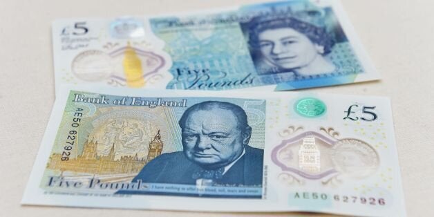 The new £5 (6.5 euros, $7.2) banknote bearing the image of wartime leader Winston Churchill is on show at its unveiling by the Bank of England at Blenheim Palace in Woodstock on June 2, 2016. The note, to be rolled out from September, is the first to be printed on polymer -- a thin, flexible plastic film that is seen as more durable and secure and is already used in Australia and Canada. / AFP / POOL / Joe Giddens (Photo credit should read JOE GIDDENS/AFP/Getty Images)