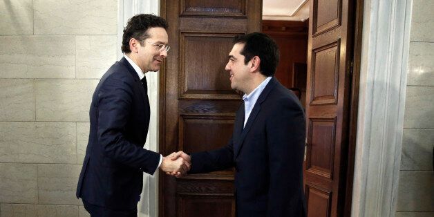 Jeroen Dijsselbloem (L), head of the euro zone finance ministers' group, is welcomed by Greece's Prime Minister Alexis Tsipras at his office in Athens, January 30, 2015. Dijsselbloem said on Thursday the new Greek government led by the left-wing, anti-bailout Syriza party, could derail reforms and economic recovery if it sticks to its election campaign promises. REUTERS/Petros Giannakouris/Pool (GREECE - Tags: POLITICS BUSINESS)
