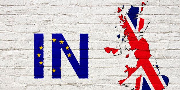 Brexit: Map of the United Kingdom and the word 'In' suggesting the UK remains within the European Union painted onto a white brick wall