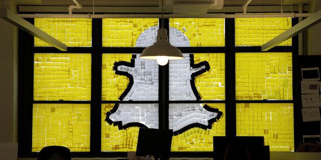 An image of the Snapchat logo created with Post-it notes is seen in the windows of Havas Worldwide at 200 Hudson Street in lower Manhattan, New York, U.S., May 18, 2016, where advertising agencies and other companies have started what is being called a