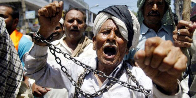 West Pakistani refugees shout slogans against the Indian government protesting discrimination in Jammu, India, Wednesday, Aug. 15, 2007. The West Pakistani Refugee Action Committee has decided to observe Indian Independence Day as