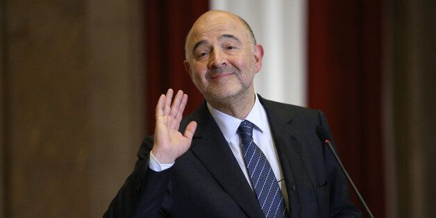 The European Comissioner for Economic and Finacial Affairs Pierre Moscovici gestures during a news conference, following his meeting with Portuguese Finance Minister Mario Centeno at the Finance Ministry in Lisbon, Thursday, March 10 2016. Moscovici, Europe's top official for economic affairs, says he is monitoring Portugal's new government closely to make sure the debt-heavy country's financial troubles don't return as it tries to shift its policy focus from austerity to growth. (AP Photo/Armando Franca)