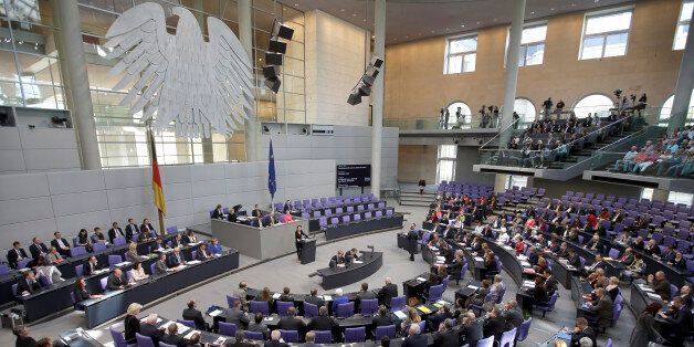 Lawmakers attend a debate at the German Federal Parliament, Bundestag, in Berlin, Germany, Friday, April 24, 2015. Germany's parliamentary speaker Norbert Lammert said the slaughter of Armenians by Ottoman Turks 100 years ago was genocide, saying Germany's own past makes it important to speak out. (AP Photo/Michael Sohn)