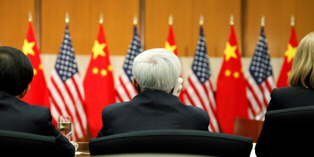 Delegates listen to opening remarks by China's State Councilor Yang Jiechi and U.S. Deputy Secretary of State William Burns (both not pictured) at the Strategic Track Plenary Session of the U.S.-China Strategic and Economic Dialogue (S&ED) at the State Department in Washington July 11, 2013. REUTERS/Jonathan Ernst/ File Photo