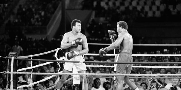 In this photo taken on October 30, 1974 shows the fight between US boxing heavyweight champions, Muhammad Ali (L) (born Cassius Clay) and George Foreman in Kinshasa. On October 30, 1974 Muhammad Ali knocked out George Foreman in a clash of titans known as the 'Rumble in the Jungle', watched by 60 000 people in the stadium in Kinshasa and millions elsewhere. AFP PHOTO (Photo credit should read STR/AFP/Getty Images)