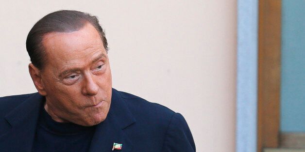 Former Italian Prime Minister Silvio Berlusconi arrives at the Sacred Family Foundation, where he will serve part of his one-year tax fraud sentence by doing community service with the elderly, in Cesano Boscone, a small town on the outskirts of Milan May 9, 2014. The Milan court ruled that Berlusconi, one of Italy's richest men, must spend at least four hours a week in an old people's home. After completing the first six months, Berlusconi's one-year sentence will automatically be reduced to 10 and a half months. REUTERS/Stefano Rellandini (ITALY - Tags: POLITICS CRIME LAW SOCIETY)