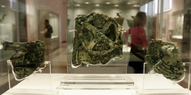 Fragments of the 2,100-year-old Antikythera Mechanism, believed to be the earliest surviving mechanical computing device, are seen at the National Archaeological Museum in Athens, Thursday, Nov. 30, 2006. The bronze system of cogs and wheels was found in a Roman wreck off southern Greece in 1900. It is the focus of a two-day conference starting in Athens Thursday, with the participation of scientists from Greece, Britain, the U.S. and other countries. (AP Photo/Thanassis Stavrakis)