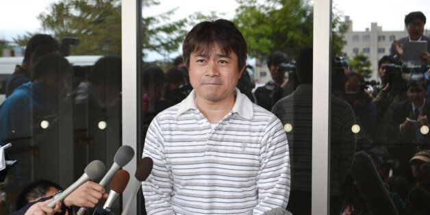 Takayuki Tanooka, father of Yamato Tanooka, a seven-year-old boy missing since being abandoned in a bear-inhabited forest in northern Japan, speaks to reporters in Hakodate on June 3, 2016. The boy, apparently unharmed and in good health, was discovered at a military base. Reports said he had taken shelter in a hut and found a tap to drink from but was hungry and immediately asked for food when discovered. / AFP / JIJI PRESS / JIJI PRESS / Japan OUT (Photo credit should read JIJI PRESS/A