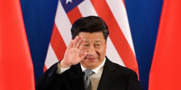 China's President Xi Jinping waves after delivering an opening speech for the 8th U.S.-China Strategic and Economic Dialogues and the 7th U.S.-China High-Level Consultation on People-to-People Exchange at Diaoyutai State Guest House in Beijing, Monday, June 6, 2016. (AP Photo/Andy Wong)