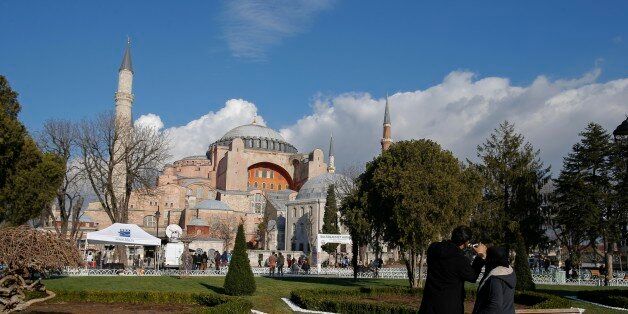 Tourists take pictures of the Byzantine-era Hagia Sophia, near the site of Tuesday's explosion, in the historic Sultanahmet district in Istanbul, Thursday, Jan. 14, 2016. A suicide bomber detonated a bomb in the heart of Istanbul's historic district on Tuesday morning, killing a number of German tourists and wounding over a dozen others, in the latest in a string of attacks by the Islamic extremists targeting westerners. (AP Photo/Emrah Gurel)
