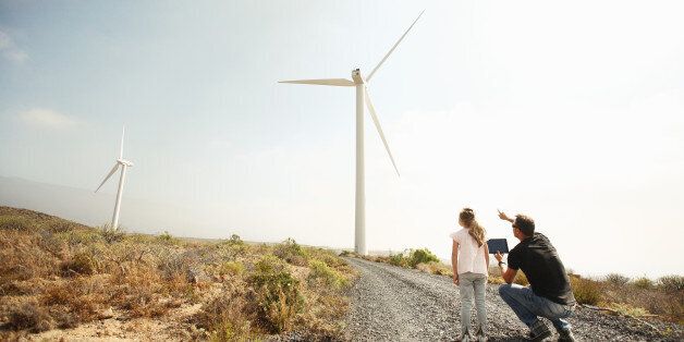 Father showing daughter windmills