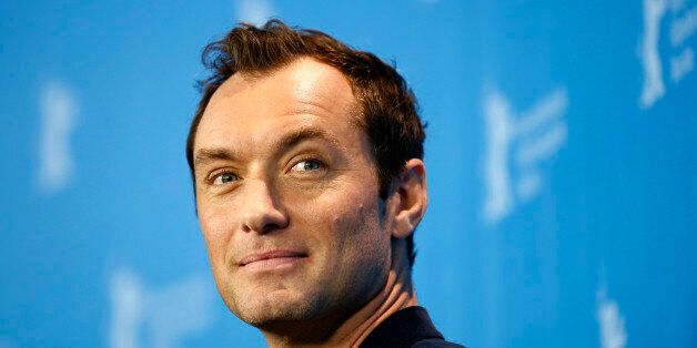 Actor Jude Law smiles during a photocall for 'Genius' during the 2016 Berlinale Berlin Film Festival in Berlin, Germany, Tuesday, Feb. 16, 2016. (AP Photo/Axel Schmidt)