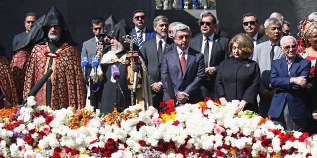 YEREVAN, ARMENIA - APRIL 24: President Serzh Sargsyan and actor George Clooney attend the laying of the flowers at the Genocide Memorial in Yerevan, Armenia for the 101st anniversary of the Armenian Genocide on April 24, 2016 in Yerevan, Armenia. (Photo by Andreas Rentz/Getty Images for 100 Lives)