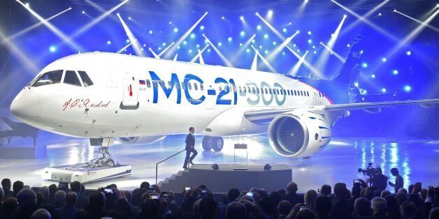 Russian Prime Minister Dmitry Medvedev arrives to give a speech in front of the new MC-21 medium-haul airliner during the roll-out ceremony at an aircraft plant in Irkutsk on June 8, 2016. / AFP / SPUTNIK / Alexander Astafyev (Photo credit should read ALEXANDER ASTAFYEV/AFP/Getty Images)