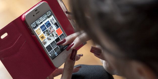 Young girl typing smart phone