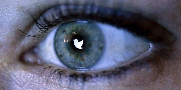 An illustration picture shows the Twitter logo reflected in the eye of a woman in Berlin, November 7, 2013. REUTERS/Fabrizio Bensch/Illustration/File Photo GLOBAL BUSINESS WEEK AHEAD PACKAGE - SEARCH 'BUSINESS WEEK AHEAD APRIL 25' FOR ALL IMAGES