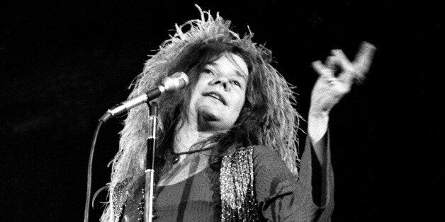 Rock concert replace Met fans at Shea Stadium. A 12-hour 'summer festival for peace,' sponsored by Peace Inc., bombarded hip music buffs with amply-amplified rock musc. Rock singer Janis Joplin, demanding lights out for performance, does her thing. (Photo By: /NY Daily News via Getty Images)