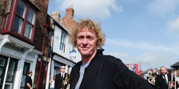 DURHAM, ENGLAND - JULY 11: Artist Grayson Perry joins the march during the annual Durham Miners Gala on July 11, 2015 in Durham, England. This is the 131st gala which brings together the communal values, culture and mining heritage of the north east of England. Thousands of people attend the event to listen to the brass bands, socialise and show their allegiance to the banners from the former colliery villages throughout the north. (Photo by Ian Forsyth/Getty Images)