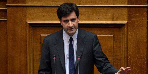 Greek Deputy Finance Minister Giorgos Chouliarakis addresses lawmakers during a parliament session prior the confidence vote of the new government at the Greek parliament in Athens late on October 7, 2015. AFP PHOTO/ LOUISA GOULIAMAKI (Photo credit should read LOUISA GOULIAMAKI/AFP/Getty Images)