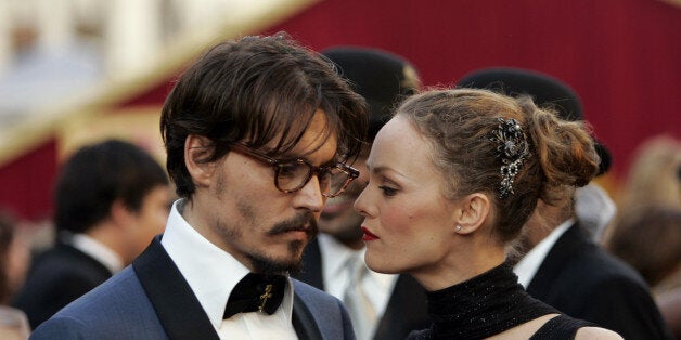 Johnny Depp shares a moment with his partner, French actress Vanessa Paradis, as they arrive atthe 77th Academy Awards Sunday, Feb. 27, 2005, in Los Angeles. Depp is nominated for an Oscar for best actor in a leading role for his work in