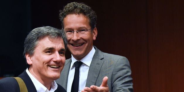Greek Finance Minister Euclid Tsakalotos (L) talks with Dutch Finance Minister and president of the Eurogroup Jeroen Dijsselbloem (R) during a Eurogroup meeting at the EU headquarters in Brussels on May 9, 2016. / AFP / JOHN THYS (Photo credit should read JOHN THYS/AFP/Getty Images)
