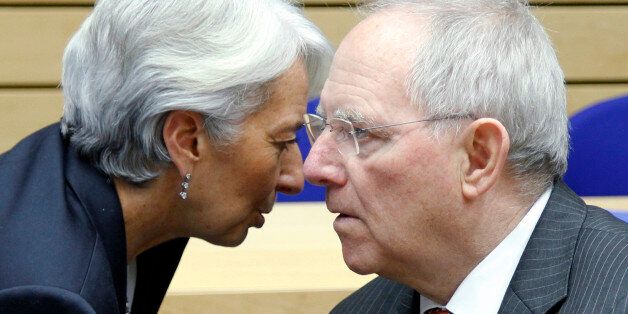 IMF Managing Director Christine Lagarde (L) talks with Germany's Finance Minister Wolfgang Schaeuble at the start of a Eurogroup meeting ahead of a two-day EU leaders summit in Brussels March 1, 2012. Euro zone finance ministers and officials were meeting in Brussels on Thursday to discuss Greece's private sector bond exchange and implementation of the Greek authorities' commitments to economic and structural reforms. REUTERS/Francois Lenoir (BELGIUM - Tags: POLITICS BUSINESS)