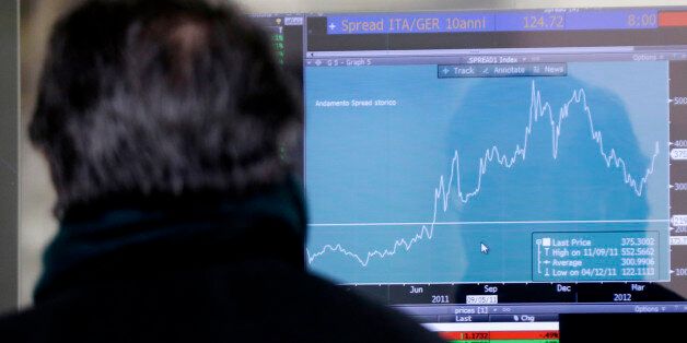A man watches a monitor showing graphic of spread performance between Italian and German bonds, in Milan, Italy, Thursday, Jan. 15, 2015. The European Union is setting the door ajar for member states struggling with debt to still keep a measure of spending leeway despite strict EU rules on deficits and debt. EU officials raised the possibility Wednesday for nations like Italy and France to add to the planned 315-billion euro ($37- billion) investment scheme aimed at spurring growth and jobs in Europe even if their budgets are already under scrutiny by the EU for overspending. (AP Photo/Luca Bruno)