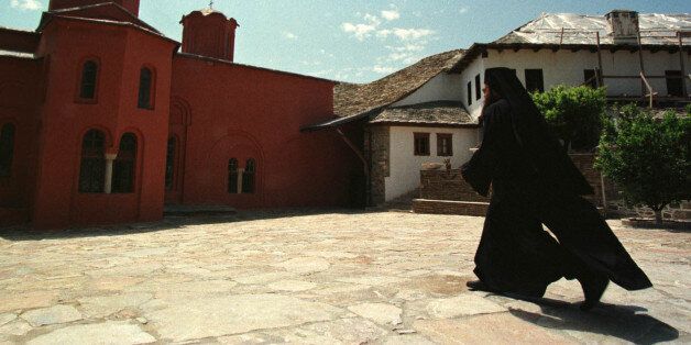 An Orthodox monk walks in courtyard of a monastery of autonomous community of Mount Athos in northern Greece May 10. Portuguese Prime Minister Antonio Guterres visited monasteries of Mount Athos during his semi-official three-day visit to Greece.YK/GB