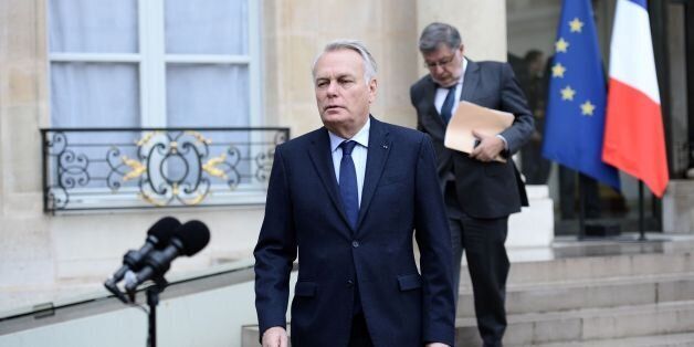 French Foreign minister Jean-Marc Ayrault, flanked by French junior minister for Transport, Maritime Economy and Fishery Alain Vidalies (R), arrives to speak to journalists following a crisis meeting of top ministers at the Elysee Presidential palace in Paris, after an EgyptAir flight from Paris to Cairo disappeared from radar.Egyptian search teams combed the Mediterranean for signs of an EgyptAir flight that vanished from radar screens en route from Paris to Cairo on May 19, 2016 with 66 people