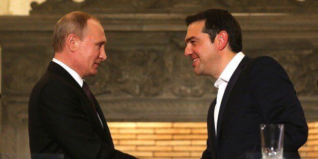 ATHENS, GREECE - MAY 27: Russian President Vladimir Putin (L) and Greek Prime Minister Alexis Tsipras (R) shake hands after they hold a joint press conference following their meeting in Athens, Greece on May 27, 2016. (Photo by Pool / Orestis Panagiotou/Anadolu Agency/Getty Images)