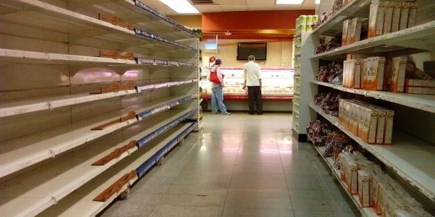 An empty supermarket is pictured in Caracas on May 28, 2016. The shortage of basic foodstuffs in Venezuela exceeds 80 percent, a survey revealed. / AFP / JUAN BARRETO (Photo credit should read JUAN BARRETO/AFP/Getty Images)