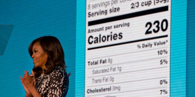 First lady Michelle Obama announces a makeover for food nutrition labels with calories listed in bigger, bolder type and a new line for added sugars, while speaking to the Building a Healthier Future Summit in Washington, Friday, May 20, 2016. (AP Photo/Jacquelyn Martin)