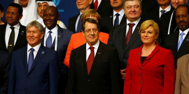 Cyprus' President Nicos Anastasiades (C) is pictured with Kyrgyz President Almazbek Atambayev (L) and Croatia's President Kolinda Grabar Kitarovic (R) during a family photo session at the World Humanitarian Summit in Istanbul, Turkey, May 23, 2016. REUTERS/Murad Sezer