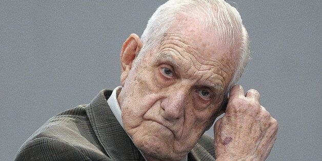 Last Argentine dictator (1982-1983) and Army chief Reynaldo Bignone gestures at the courtroom before being sentenced during his trial, in Munro, Buenos Aires on April 20, 2010. Bignone, 81, is charged with the kidnapping and torture of 56 people who were held in secret detention centers at the Campo de Mayo military base, on the outskirts of Buenos Aires during Argentina's 'dirty war' against leftists. In addition to the kidnapping and torture charges, Bignone is accused of having stolen children from some of the kidnapped detainees. AFP PHOTO / JUAN MABROMATA (Photo credit should read JUAN MABROMATA/AFP/Getty Images)