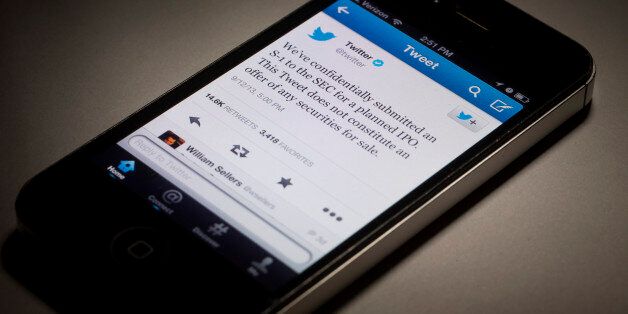 A Twitter Inc. tweet regarding the company's IPO is displayed on a mobile device for a photograph in New York, U.S., on Monday, Sept. 16, 2013. Twitter Inc., which announced plans last week for an initial public offering, is still deciding whether to list on the New York Stock Exchange or Nasdaq Stock Market, setting off a horse race for the high-profile deal. Photographer: Scott Eells/Bloomberg via Getty Images
