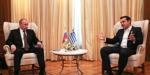 Greek Prime Minister Alexis Tsipras (R) talks with Russian President Vladimir Putin during their meeting in Athens on 27 May 2016. REUTERS/Orestis Panagiotou/Pool