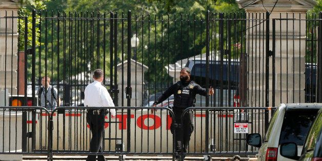 Police secure a location after a shooting near the White House in Washington DC, U.S. May 20, 2016. REUTERS/Jonathan Ernst