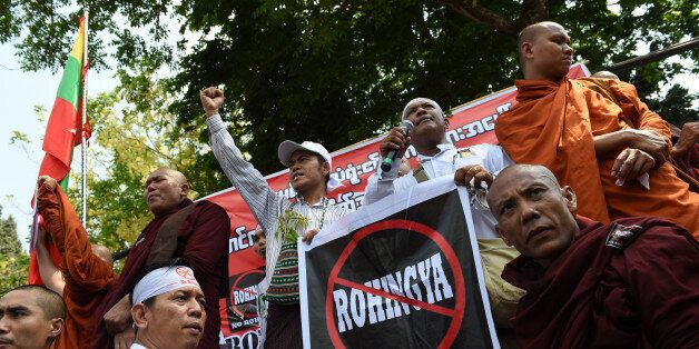Supporters and monks belonging to the hardline Buddhist group Mabatha rally outside the US embassy in Yangon on April 28, 2016. The Buddhist ultra-nationalist group denounce the US embassy recent statement related to the deaths of the Rohingya Muslim minority from the April 19, 2016 boat accident in Sittwe. / AFP / ROMEO GACAD (Photo credit should read ROMEO GACAD/AFP/Getty Images)