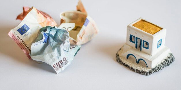 The shoot is topical as it represents Greece debt crisis using Euro banknotes and a typical Greek little house. The crumpled banknotes represent Greek money crunch and also the possibility Greece goes out of the Euro zone. The focus is on the word âEuroâ and its translation into greek letters.